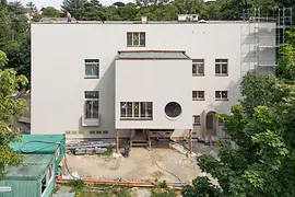 Villa Beer during renovation with scaffolding and exposed entrance area.