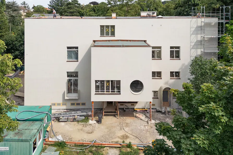 Villa Beer during renovation with scaffolding and exposed entrance area.