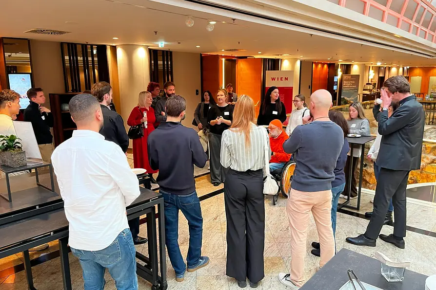 Participants take part in an accessibility awareness training session at the Vienna Marriott Hotel. The image shows practical learning to improve inclusive service and barrier-free access.