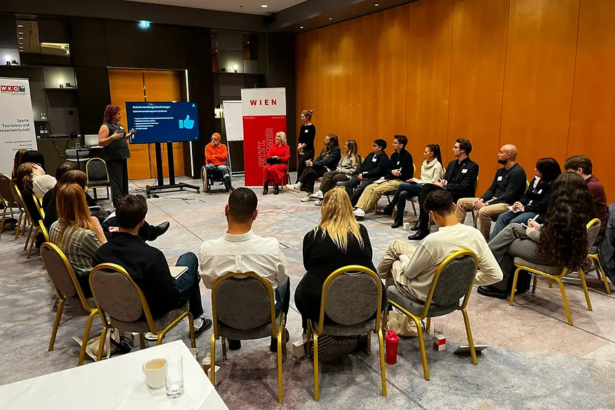 Participants take part in an accessibility awareness training session at the Vienna Marriott Hotel. The image shows practical learning to improve inclusive service and barrier-free access.