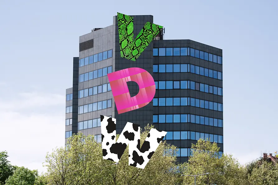 Festival headquarters of VIENNA DESIGN WEEK 2026 with colourful graphic installations on the façade of an office building.