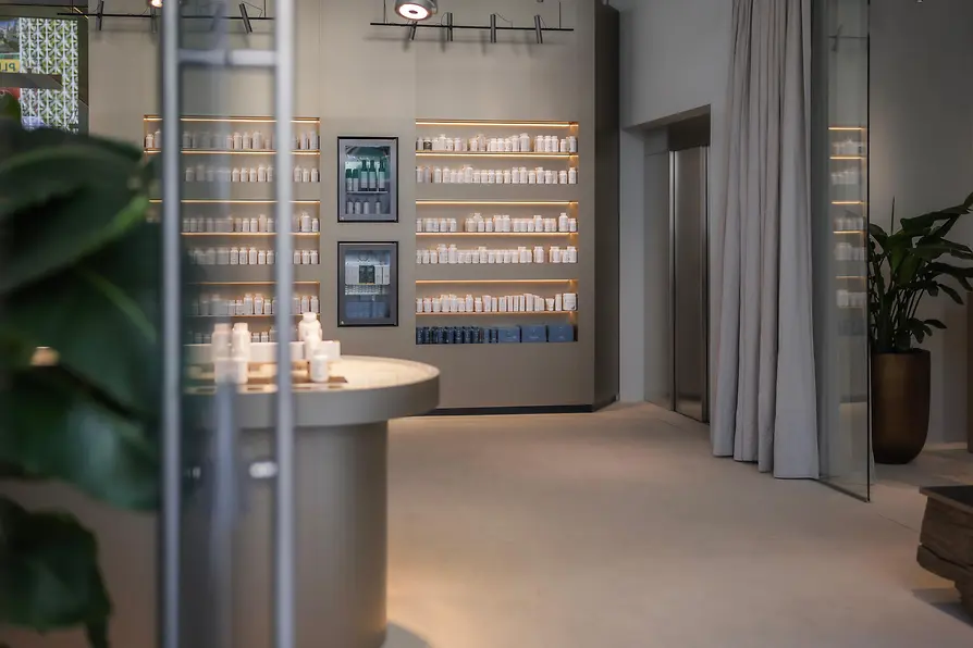 Interior of the BIOGENA store on Mariahilfer Straße with shelves stocked with dietary supplements.