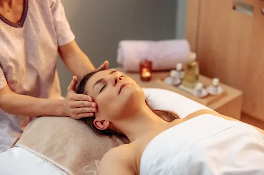 Guest receiving a head massage at Sans Souci Spa.