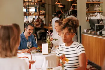 Guests eating and drinking at a restaurant