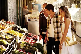 Naschmarkt, people standing in front of a vegetable stall