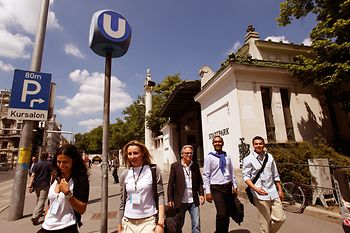 Group of people in front of the Stadtpark subway station