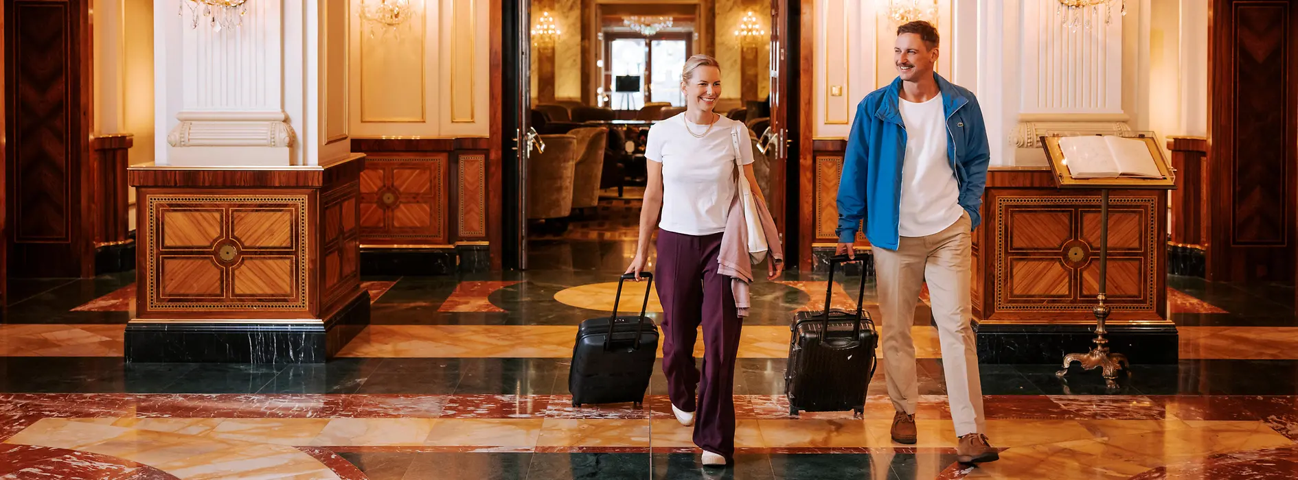 Two women with luggage in a Viennese hotel