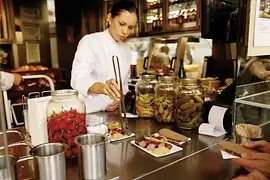 woman preparing sausage