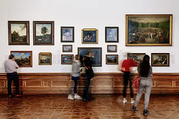 People look at paintings in the Upper Belvedere