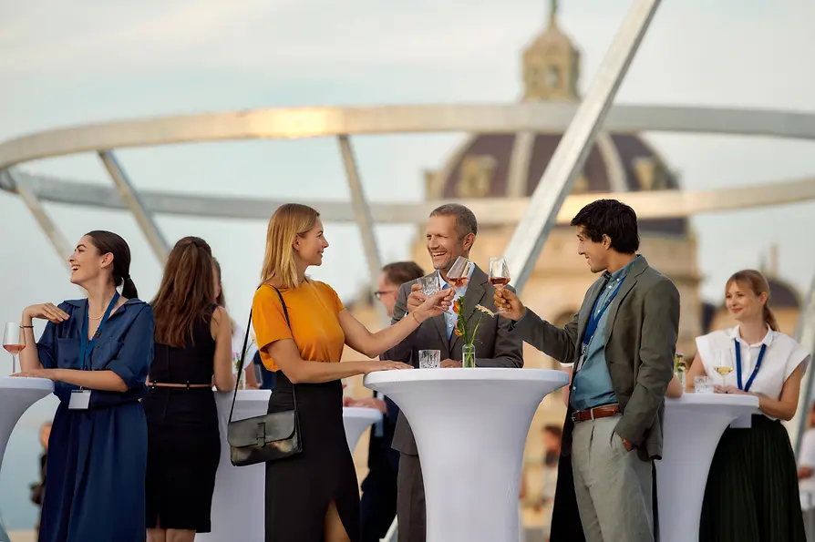 WienTourismus/David Payr / MQ Libelle People standing at tall tables on the terrace