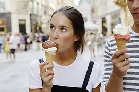 Young couple eating ice cream in Vienna's Old City