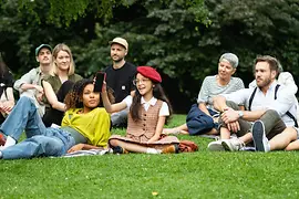 ivie commercial, people sitting on a meadow
