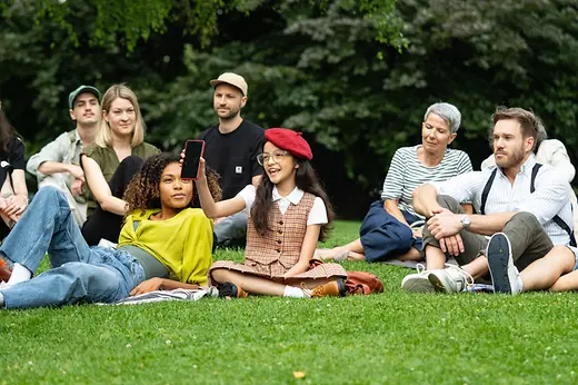 ivie commercial, people sitting on a meadow