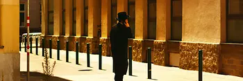 An orthodox Jew makes a telephone call in a street in Vienna