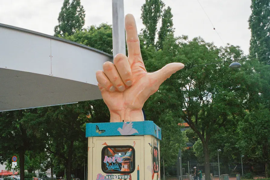 Meidlinger Markt, telephone booth with a sculpture of a hand on top