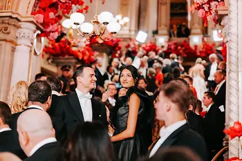 Ball guests on the grand staircase at the Vienna Opera Ball in the Vienna State Opera