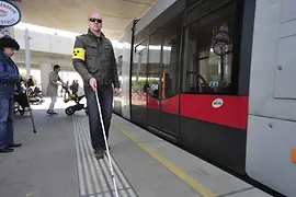 Wiener Linien, blind man with stick, guidelines, tram