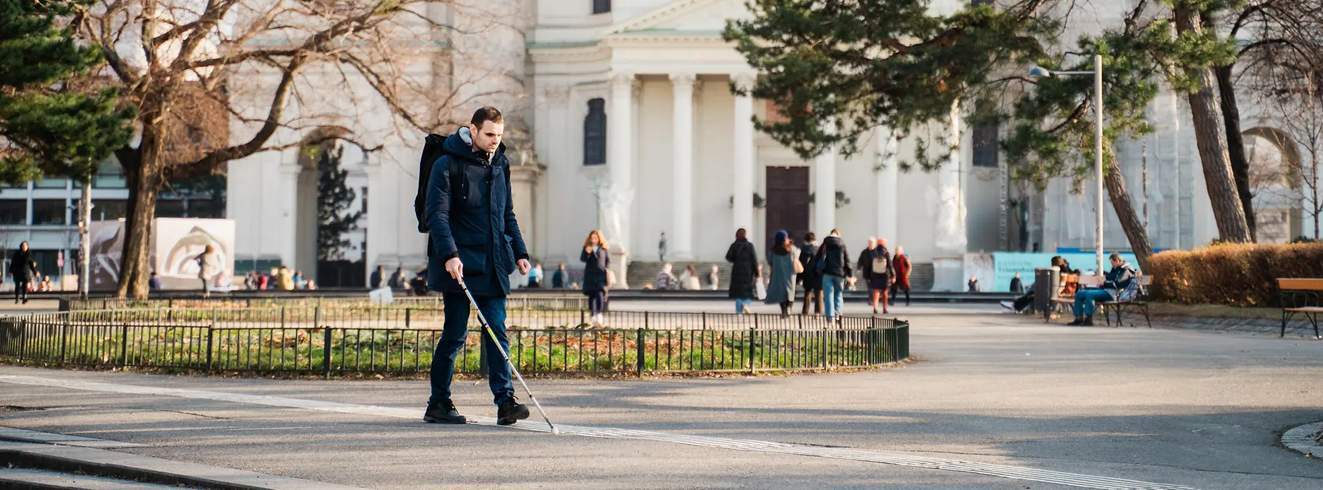Blind person uses tactile guidance system on the floor. 