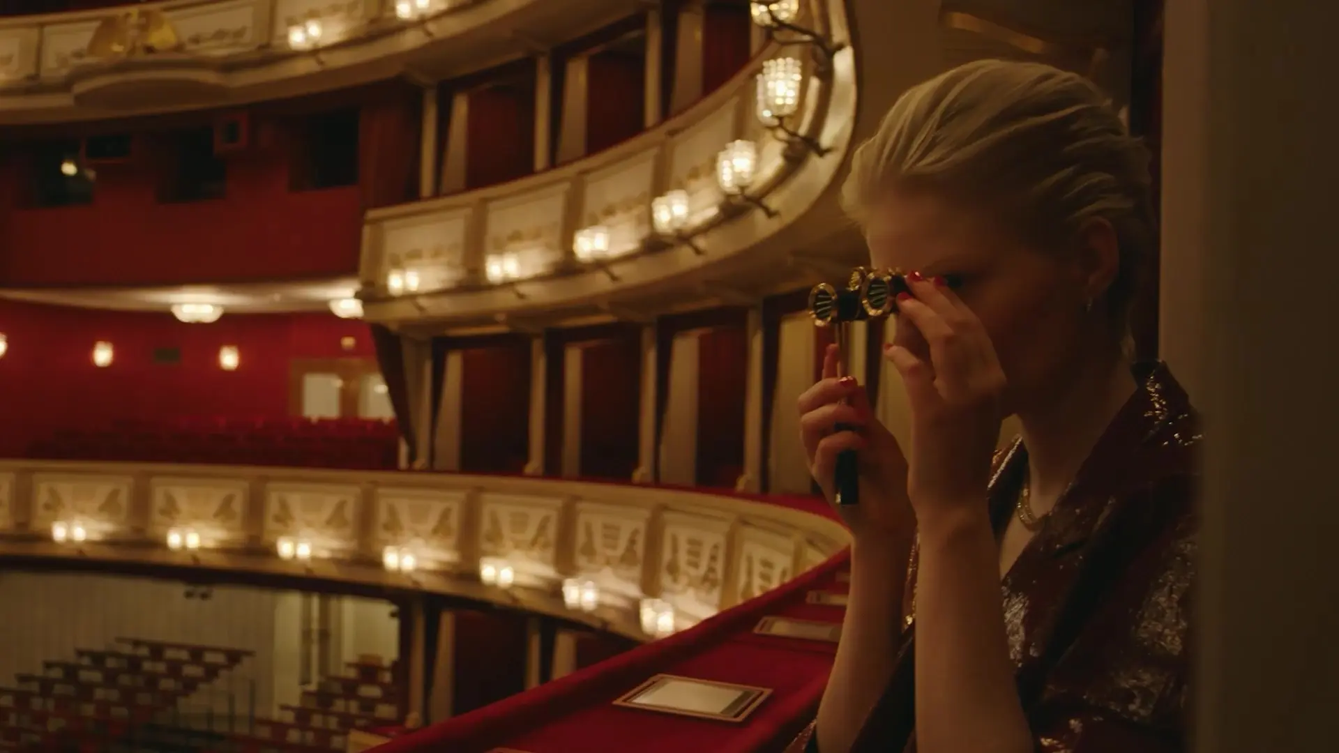 Woman with opera binoculars at the Vienna States Opera
